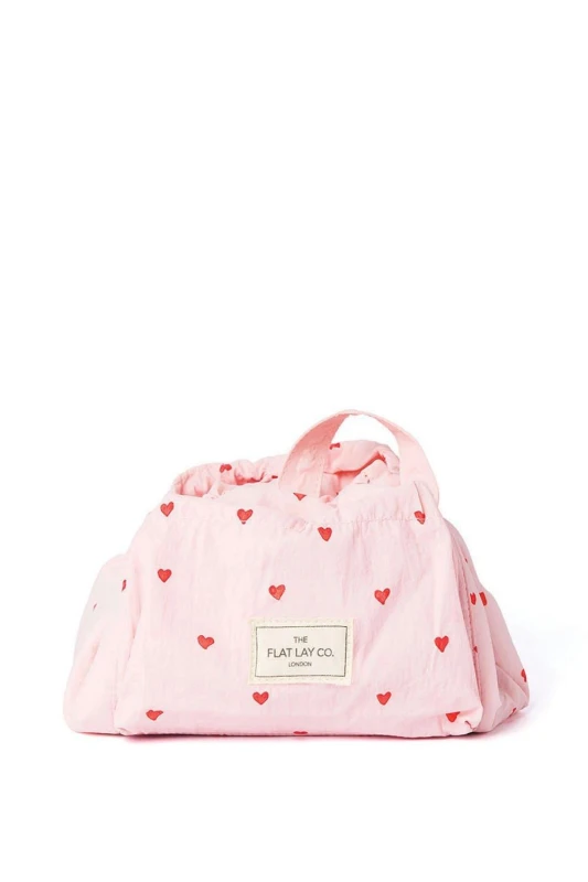 Image of The Flat Lay Co Drawstring Makeup Bag in Sweet Pink Hearts Parachute Multi unisex