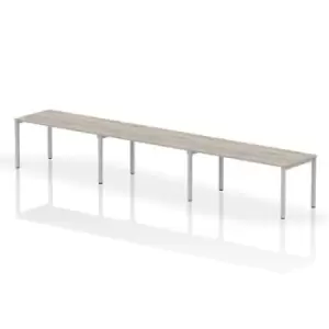 Image of Impulse Bench Single Row 3 Person 1600 Silver Frame Office Bench Desk Grey Oak
