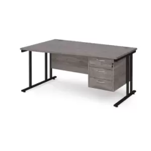 Image of Maestro 25 left hand wave desk 1600mm wide with 3 drawer pedestal - Black cantilever leg frame and grey oak top