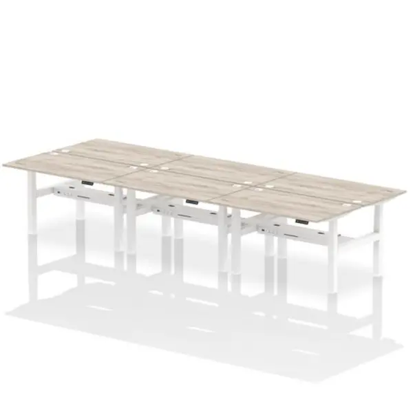 Image of Air Air Back-to-Back 1400 x 800mm Height Adjustable 6 Person Bench Desk Grey Oak Top with Cable Ports White Frame HASCP6P14800GRYW
