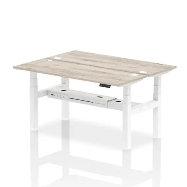 Image of Air Air Back-to-Back 1600 x 600mm Height Adjustable 2 Person Bench Desk Grey Oak Top with Cable Ports White Frame HASCP2P16600GRYW