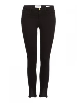 Image of Frame High Rise Split Front Skinny Jeans in Film Noir Black