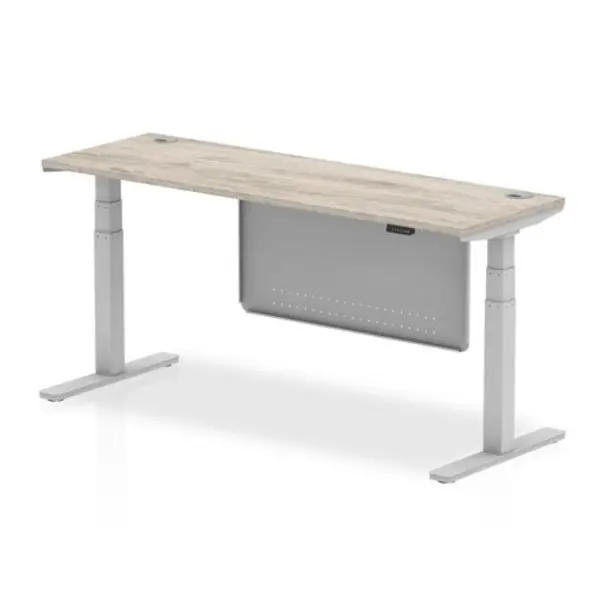 Image of Air 1800 x 600mm Height Adjustable Desk Grey Oak Top Cable Ports Silver Leg With Silver Steel Modesty Panel