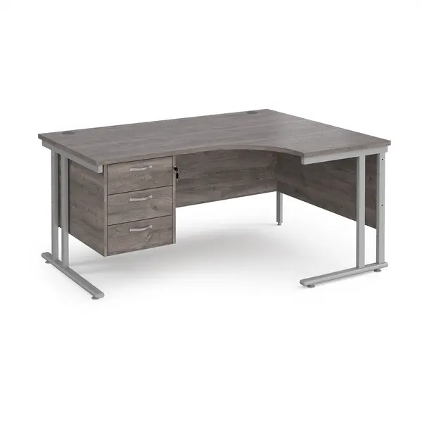 Image of Maestro 25 right hand ergonomic desk 1600mm wide with 3 drawer pedestal - silver cantilever leg frame, grey oak top