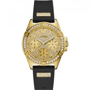 Image of GUESS Ladies gold watch with crystals, champagne glitz Multifunction dial and Black silicone strap.