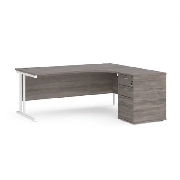 Image of Maestro 25 right hand ergonomic desk 1800mm with white cantilever frame and desk high pedestal - grey oak