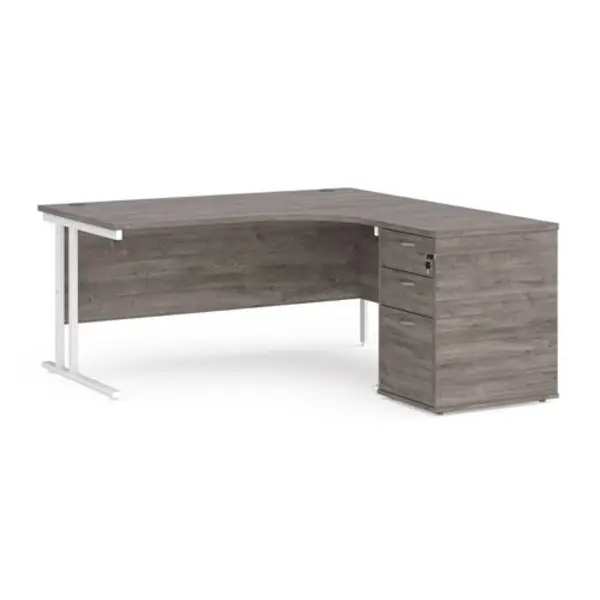 Image of Maestro 25 right hand ergonomic desk 1600mm with white cantilever frame and desk high pedestal - grey oak
