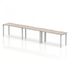 Image of Single Silver Frame Bench Desk 1400 Grey Oak (3 Pod)