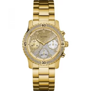 Image of GUESS Ladies gold watch with crystals, gold to silver dial and gold bracelet.