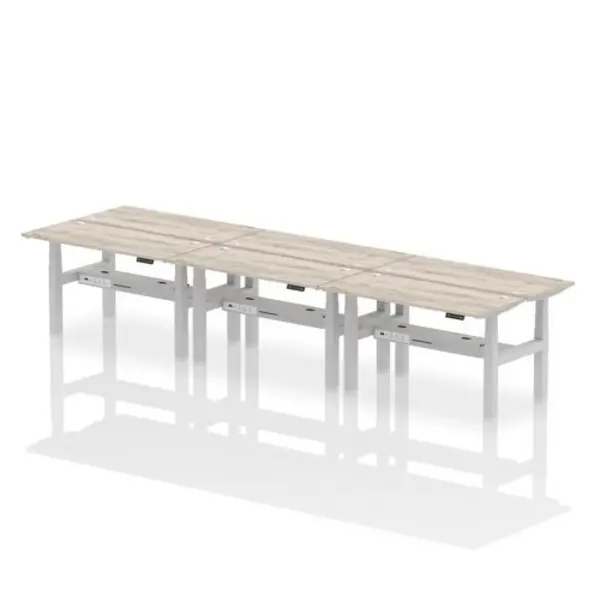 Image of Air Air Back-to-Back 1400 x 600mm Height Adjustable 6 Person Bench Desk Grey Oak Top with Cable Ports Silver Frame HASCP6P14600GRYS