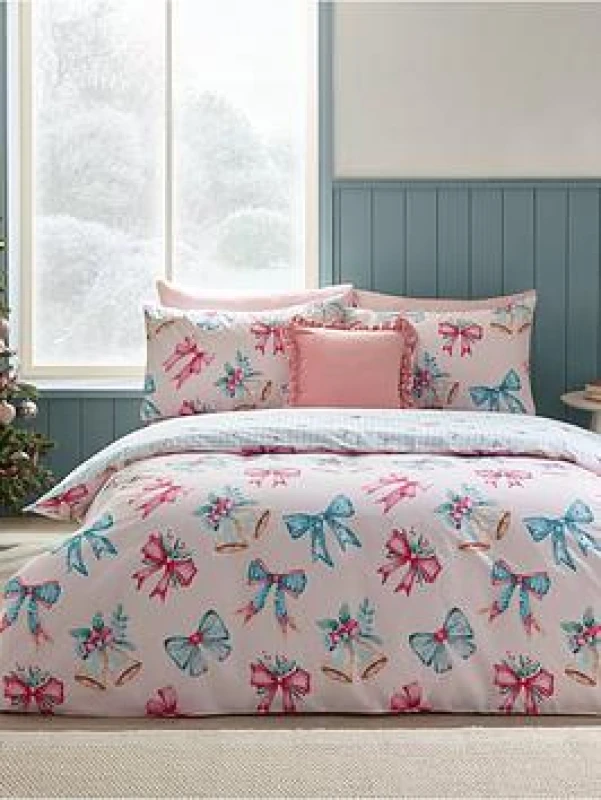 Image of Catherine Lansfield Catherine Lansfield 'Christmas Bows And Bells' Reversible Duvet Cover Set in Pink Size: King Pink King Unisex 5057681186542