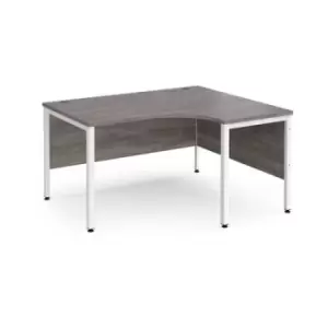 Image of Maestro 25 right hand ergonomic desk 1400mm wide - white bench leg frame and grey oak top