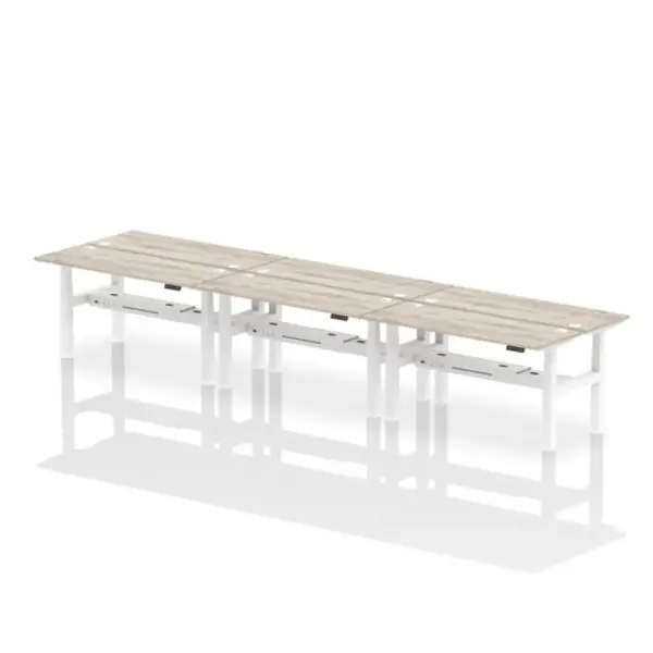 Image of Air Air Back-to-Back 1600 x 600mm Height Adjustable 6 Person Bench Desk Grey Oak Top with Cable Ports White Frame HASCP6P16600GRYW