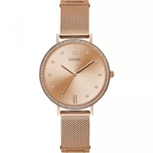 Image of GUESS Ladies rose gold watch with rose gold dial and mesh bracelet.