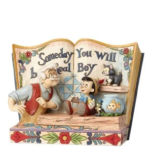 Image of Disney Traditions Someday You Will Be A Real Boy Storybook Pinocchio Figurine