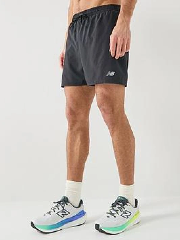 Image of New Balance SPORT ESSENTIAL LINED SHORT mens Shorts in Black