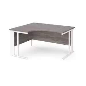 Image of Maestro 25 left hand ergonomic desk 1400mm wide - white cable managed leg frame and grey oak top