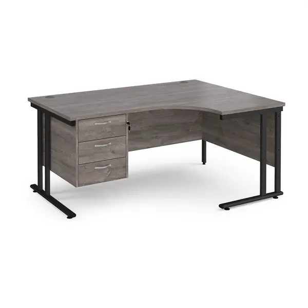 Image of Maestro 25 right hand ergonomic desk 1600mm wide with 3 drawer pedestal - Black cantilever leg frame, grey oak top