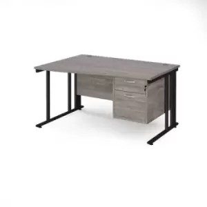 Image of Maestro 25 left hand wave desk 1400mm wide with 2 drawer pedestal - Black cable managed leg frame and grey oak top