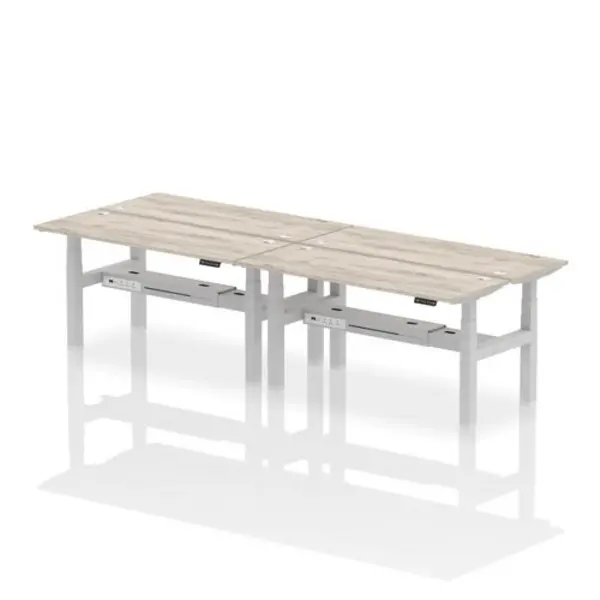 Image of Air Air Back-to-Back 1600 x 600mm Height Adjustable 4 Person Bench Desk Grey Oak Top with Cable Ports Silver Frame HASCP4P16600GRYS