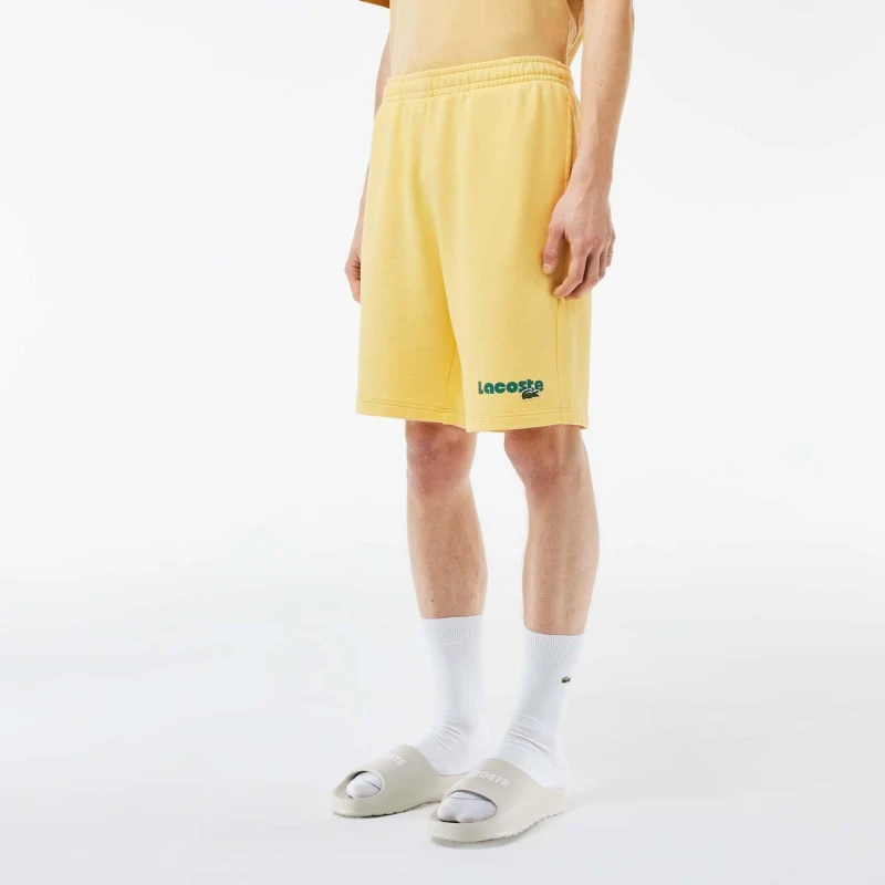 Image of Lacoste Washed Effect Printed Fleece Shorts Yellow male XS