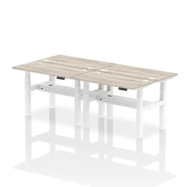 Image of Air Air Back-to-Back 1200 x 600mm Height Adjustable 4 Person Bench Desk Grey Oak Top with Cable Ports White Frame HASCP4P12600GRYW
