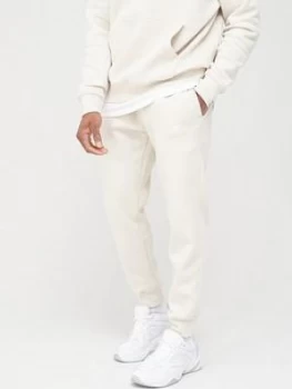 Image of Nike Sportswear Club Joggers - Stone