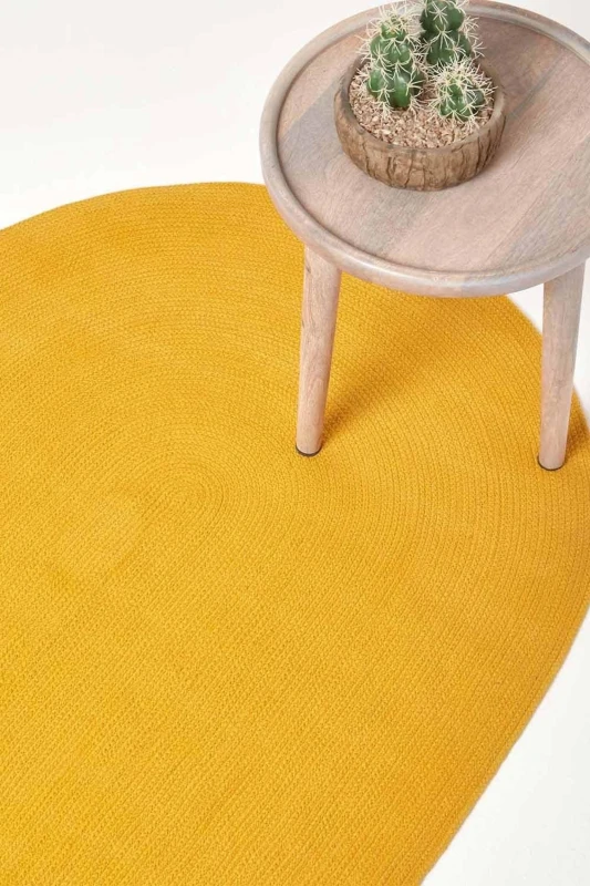 Image of HOMESCAPES Homescapes - Mustard Yellow Handmade Woven Braided Round Rug, 150cm RU1335D