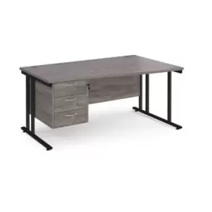 Image of Maestro 25 right hand wave desk 1600mm wide with 3 drawer pedestal - Black cantilever leg frame and grey oak top