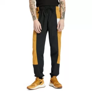 Image of Timberland Outdoor Archive Trail Tracksuit Bottoms For Men In Yellow/black Yellow/black, Size S