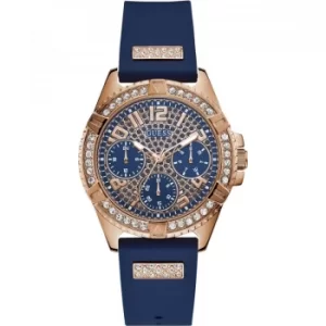 Image of GUESS Ladies rose gold watch with blue strap and glitz dial.