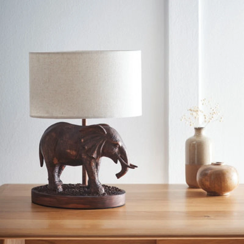 Image of K Living Elephant Lamp In An Antique Copper Resin Table Lamp With An Oval Natural Linen Shade