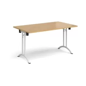 Image of Rectangular folding leg table with white legs and curved foot rails 1400mm x 800mm - oak
