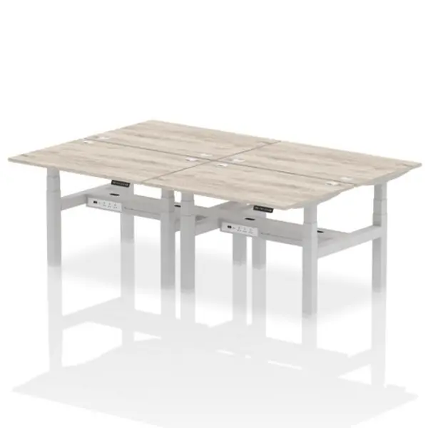 Image of Air Air Back-to-Back 1200 x 800mm Height Adjustable 4 Person Bench Desk Grey Oak Top with Cable Ports Silver Frame HASCP4P12800GRYS