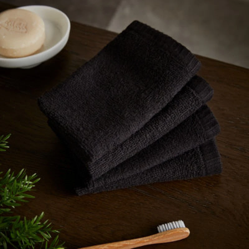 Image of Catherine Lansfield Catherine Lansfield 'Quick Dry' Face Cloth 4 Pack in Black Size: Face Towel Black Face Towel Unisex 5057681107103