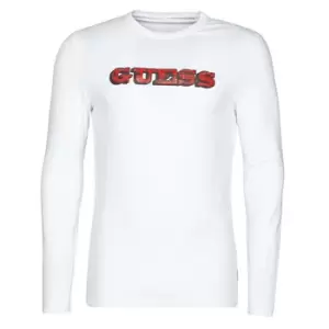 Image of Guess GUESS PROMO CN LS TEE mens in White. Sizes available:XXL,S,M,L,XL,XS