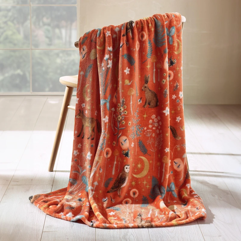Image of Catherine Lansfield Catherine Lansfield 'Enchanted Twilight Animals' Cosy Fleece Blanket Throw in Burnt Orange Size: 130cm x 170cm Burnt Orange 130c