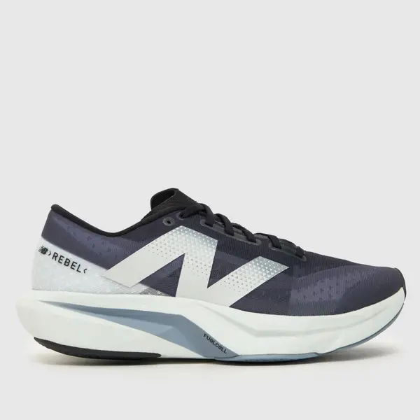 Image of New Balance fuelcell rebel v4 trainers in navy & white