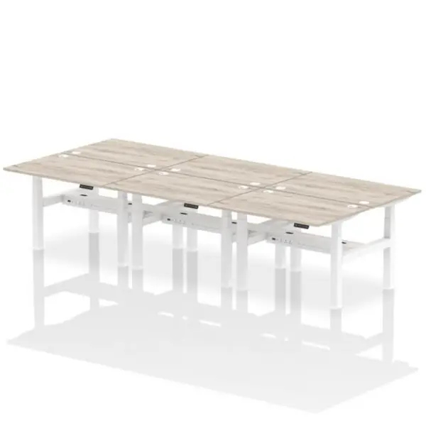 Image of Air Air Back-to-Back 1200 x 800mm Height Adjustable 6 Person Bench Desk Grey Oak Top with Cable Ports White Frame HASCP6P12800GRYW