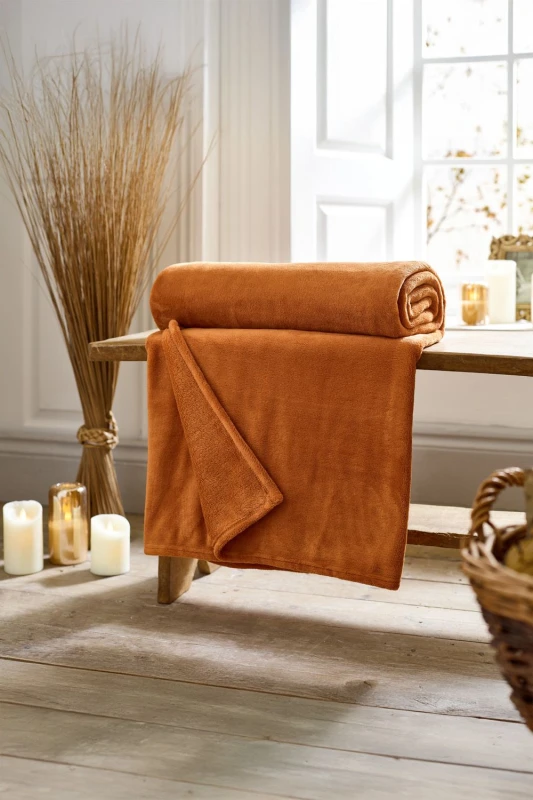 Image of Deyongs Deyongs Snuggle Touch Super Soft Solid Colour Fleece Throw in Orange Size: 140cm x 180cm Orange 140cm x 180cm Unisex 5054990142733