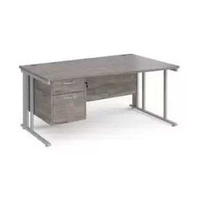 Image of Maestro 25 right hand wave desk 1600mm wide with 2 drawer pedestal - silver cable managed leg frame and grey oak top