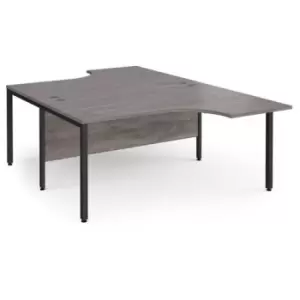 Image of Maestro 25 back to back ergonomic desks 1600mm deep - Black bench leg frame and grey oak top