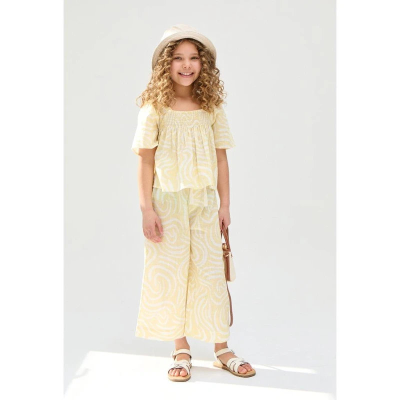 Image of Raffya Kids Nia Shirred Neck Zebra Swirl Print Co-Ords Set In Yellow Yellow female 7 Yrs