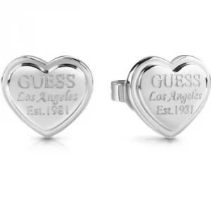 Image of GUESS rhodium plated heart-shaped stud earrings with engraved logo.