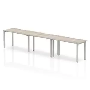 Image of Single Silver Frame Bench Desk 1200 Grey Oak 3 Pod