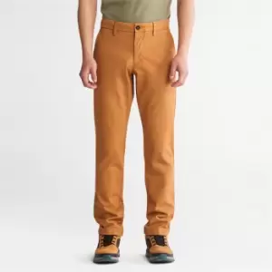 Image of Timberland Sargent Lake Stretch Chino Trousers For Men In Orange Yellow, Size 30x32
