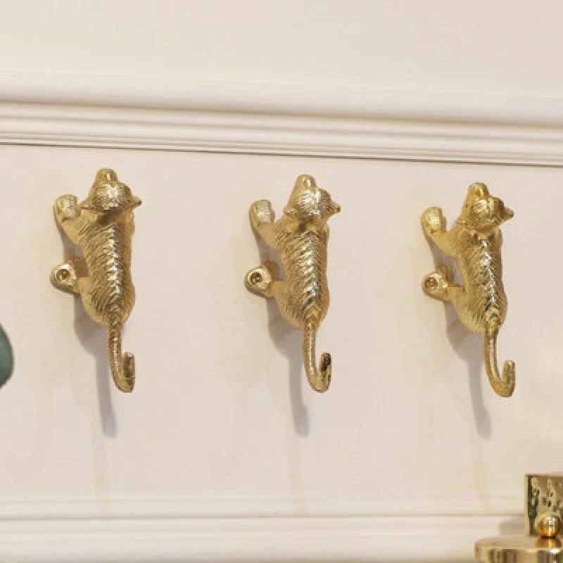 Image of Melody Maison Set Of 3 Gold Monkey Wall Hooks Metallic Gold unisex