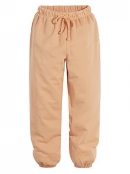Image of Levis Jersey Sweatpants - Orange, Size S, Women
