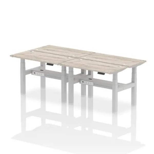 Image of Air Air Back-to-Back 1200 x 600mm Height Adjustable 4 Person Bench Desk Grey Oak Top with Cable Ports Silver Frame HASCP4P12600GRYS