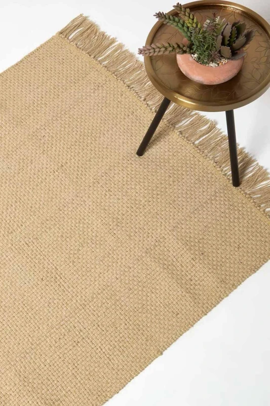 Image of HOMESCAPES Zaphyr Natural Handwoven Jute Rug with Tassels, 120 x 170cm - Homescapes RU1414D